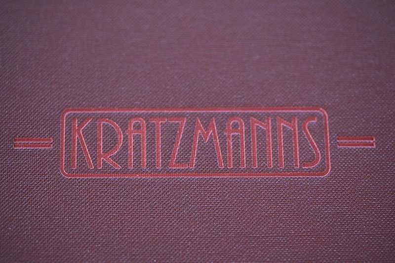 Kratzmanns – Restaurant mit Logo